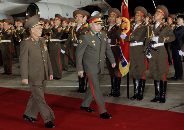 Russian and North Korean senior military walk down red carpet in North Korea